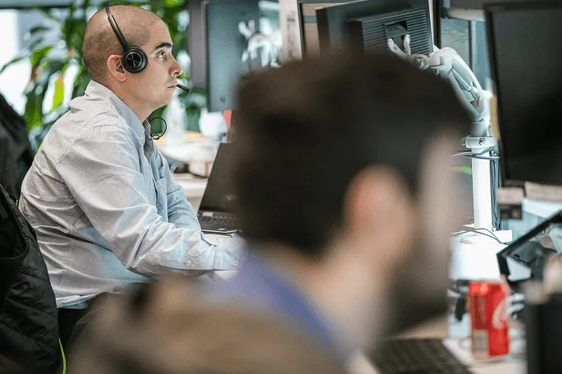 Black Lantern helpdesk engineer taking a support call in the Melbourne office
